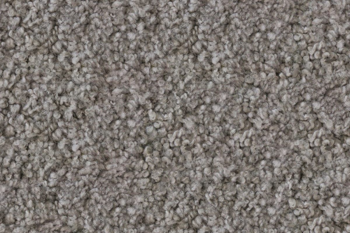 A close view of clean, soft grey carpet pile